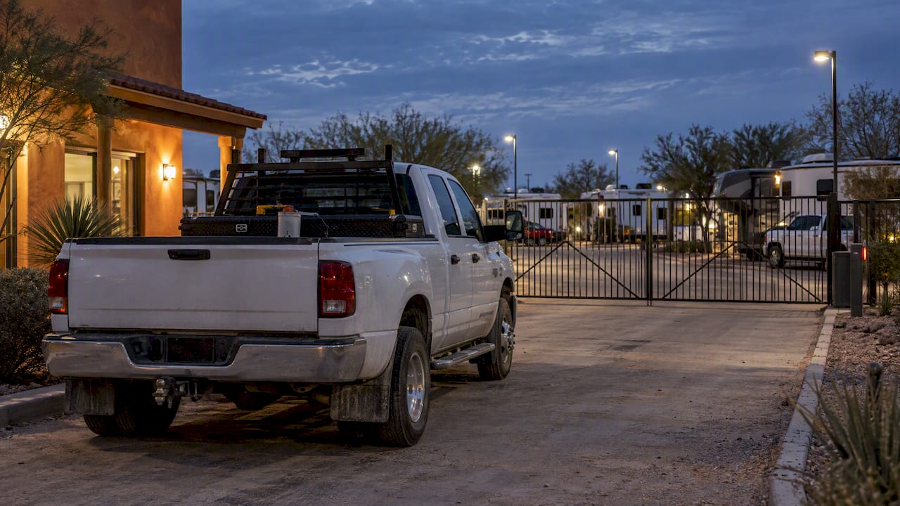 Work truck parked inside gated RV park