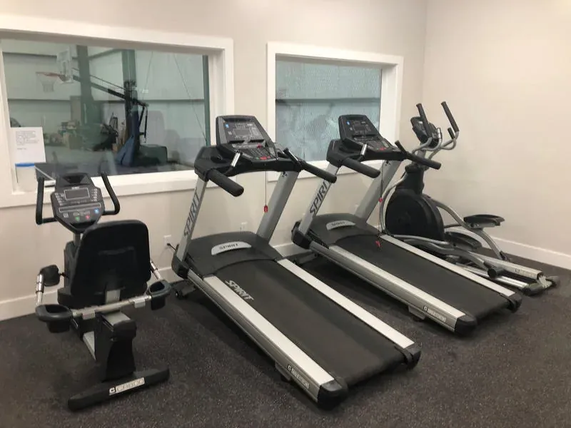 Fitness center with cardio machines and free weights