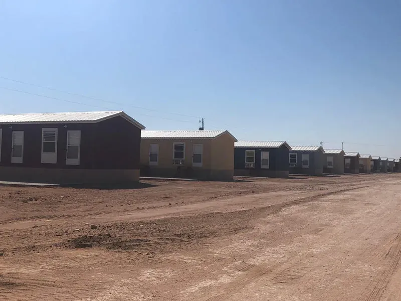 Exterior of a brown lodge building at Mesquite Oasis