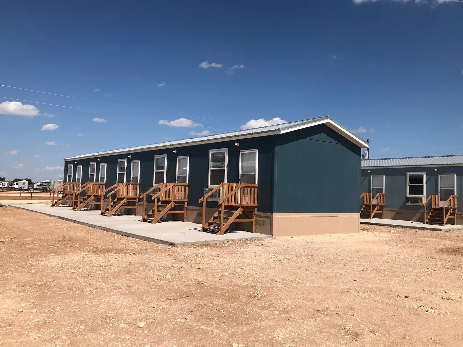 Lodge building exterior with parking at Mesquite Oasis