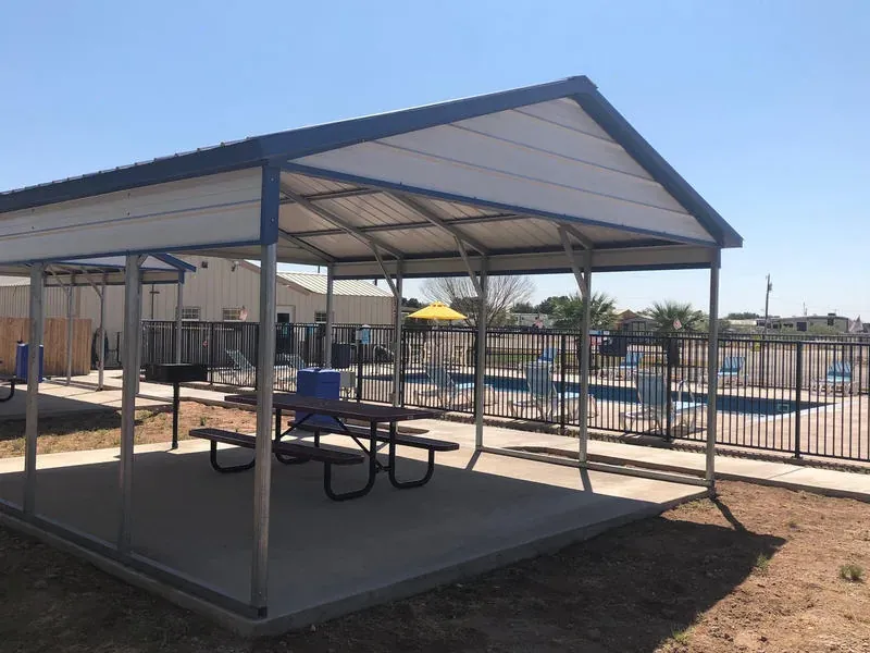 Covered outdoor pavilion with picnic tables