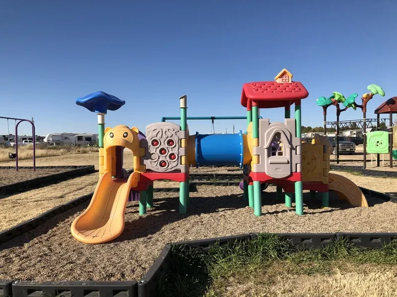 Children's playground with slides and climbing structure