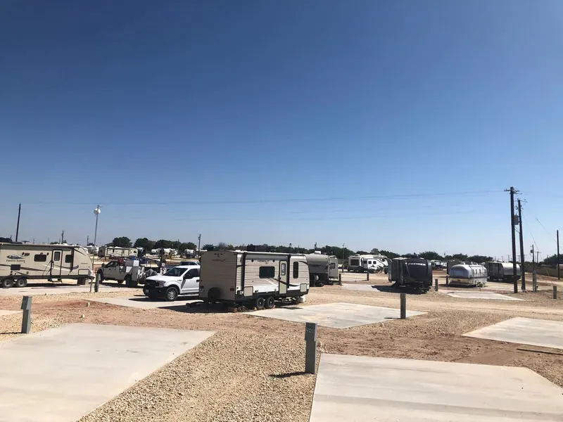 Row of RV sites with full hookups at Mesquite Oasis Lodge & RV Park in Odessa, Texas