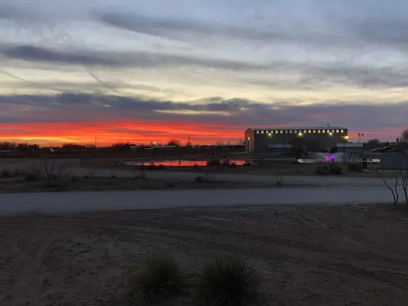 Sunset over the park at Mesquite Oasis Lodge & RV Park in Odessa, Texas